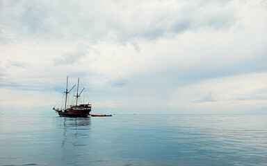 Liveaboard Dive Ship Near a Tropical Island