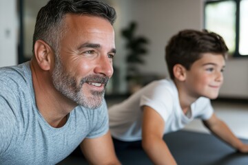 Obraz premium A smiling father and son lying on mats in a gym, fostering a sense of joy and teamwork while participating in a fun fitness activity.