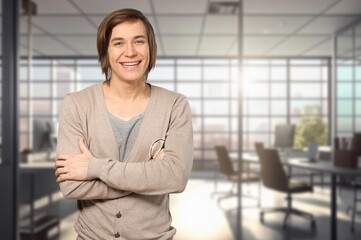 Fototapeta premium Portrait of a young business man in a modern office