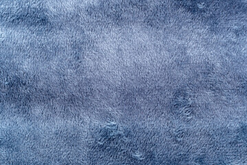Texture of dense blue fabric for tailoring. Canvas. Textile. Material. Velour