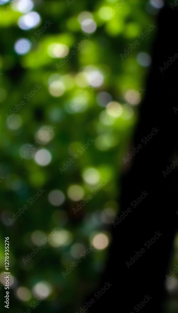 Poster generative ai, abstract nature bokeh with tree trunk silhouette and green leafy background