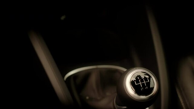 Male hand changing manual gear lever in a car stock footage