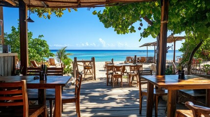 A charming beach caf with wooden tables and chairs on the veranda, the clear blue sky meeting the ocean in the distance.