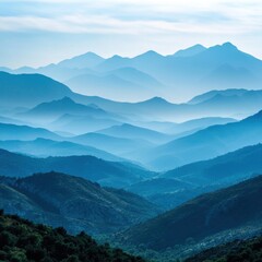 Fototapeta premium Breathtaking blue mountain landscape with layered peaks and serene atmosphere.