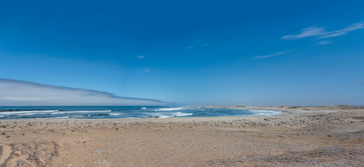 Ocean waves at bay shore, near Toscanini old mining site, Skeleton coast, Namibia