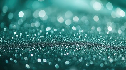 Green bokeh background. Beautiful green background with glitter and blurred and focal lights. Depth of field sparkling blue and green bokeh with light effects.