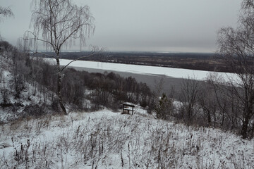 In winter on the snowy bank of the Volga River. River navigation