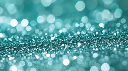 Fototapeta premium Green bokeh background. Beautiful green background with glitter and blurred and focal lights. Depth of field sparkling blue and green bokeh with light effects.