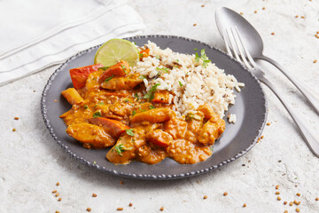 Salsify Curry with Rice on a black plate