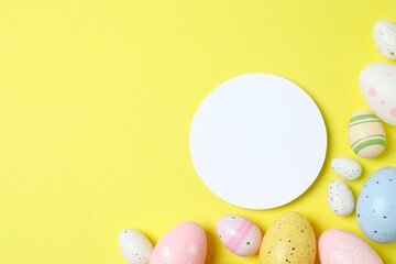 Happy Easter. Colorful eggs with paper card on color background, space for text or advertising