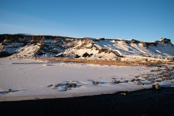 Landscape with snow covered mountains in Reynisfjara, Iceland
