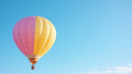 Fototapeta premium Pink yellow hot air balloon flight, clear sky. Travel adventure