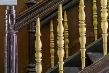 old wooden beautiful stairs in an old historical and historic residential building in the city....