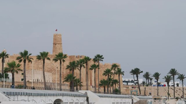 Historic ribat fort with palm trees in coastal Monastir, Tunisia