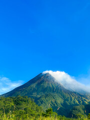 beautiful view of mount merapi against blue sky and white cloud