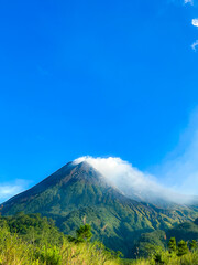 beautiful view of mount merapi against blue sky and white cloud