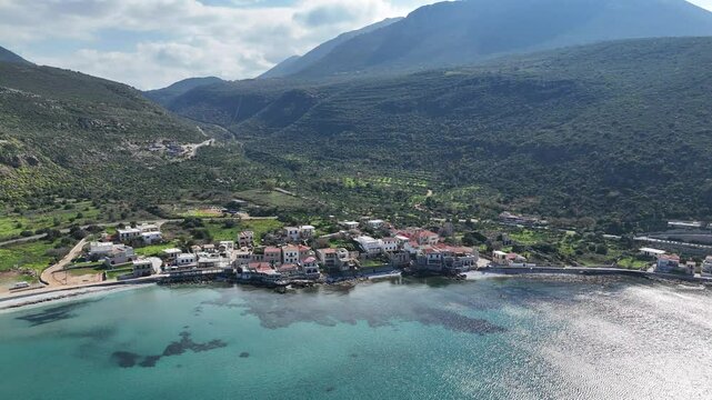 Aerial view of the coast and village of Neo Itylo with mountains in the background. Located in Mani, Laconia, Greece