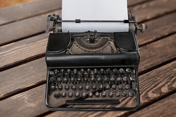 Vintage typewriter on desk. Printing ban concept