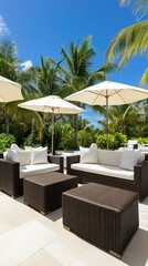 Obraz premium A spacious and comfortable outdoor seating area, nestled among lush palm trees, creates a perfect retreat in a tropical resort on a sunny day