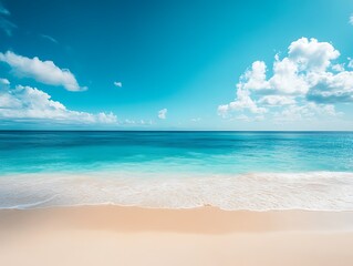 Fototapeta premium Idyllic beach scene with turquoise water, white sand, and blue sky.