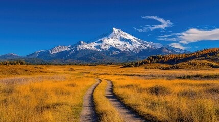 Autumnal mountain road, scenic valley, fall foliage, clear sky