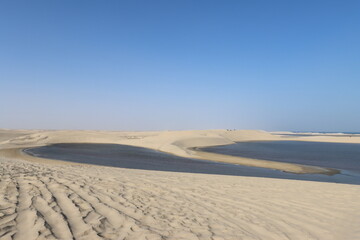 Sea entering between dunes at Inland Sea, Qatar