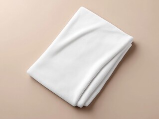 Naklejka premium beach towel mockup. A folded white towel on a beige background, showcasing a soft texture ideal for home decor or spa settings.