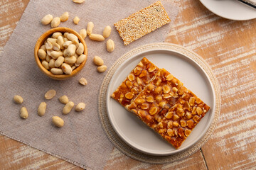 Chinese Peanut and Sesame Bar,Peanut brittle crisp candy in a plate.Thai snack.Top view.