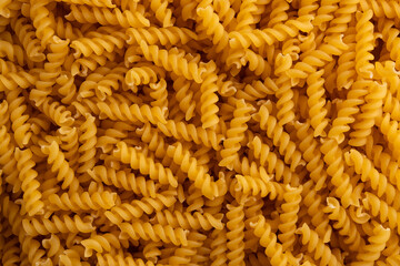 Uncooked dry Small Spirals pasta pattern for background.italian pasta.