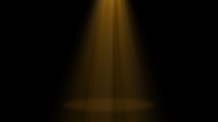 A single golden spotlight shines brightly from the top onto a studio stage, casting a warm and luxurious glow against the black background