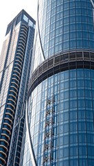 Obraz premium Modern Architecture Two Skyscrapers with Glass Facades in the Cityscape