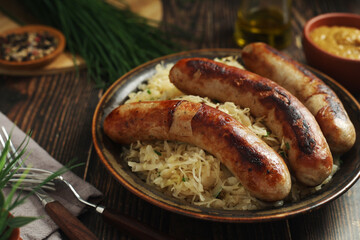 A bowl with Bratwurst and Sauerkraut as side dish - traditional German food	