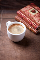 Cup of coffee on wooden background. Soft focus. Copy space.