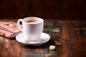 Cup of coffee on wooden background. Soft focus. Copy space	