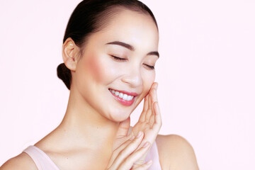 Obraz premium Clean and fresh. Pure beauty. Young Asian beautiful woman with perfect skin posing with closed eyes and smiling