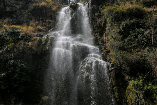 View of a beautiful waterfall in a mountain valley, Close waterfall rocks, Water show supported by rocks, Mountain waterfall, waterfall in the forest, Swat, KPK Province, Pakistan 

