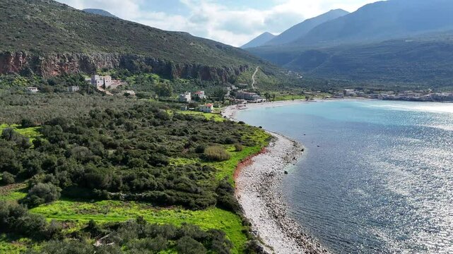 Aerial view of the coast and village of Neo Itylo with mountains in the background. Located in Mani, Laconia, Greece