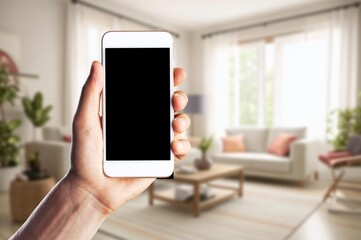 Hand hold phone with a blank screen in room