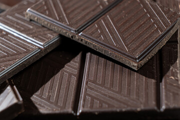 Delicious dark chocolate segments, rich black chocolate texture