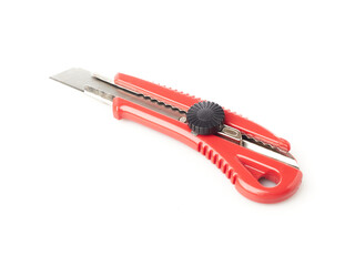 A red and silver utility cutter knife with a retractable blade sits on a plain white background, ready for use in various cutting tasks