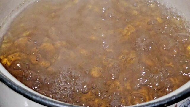 Attar or Qatir, a type of sweet syrup used in the preparation of Middle Eastern desserts, made of primarily sugar and water, and is reduced slightly until somewhat golden and thicker, lemon added