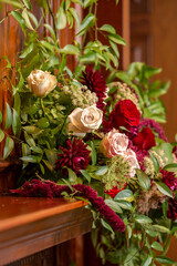 Artistic wedding flowers on fireplace mantle 