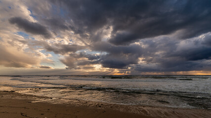 A stormy Mediterranean Sea sunset on  the coastline near Haifa, Israel. 
