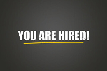 You are hired. A blackboard with white text. Illustration with grunge text style.