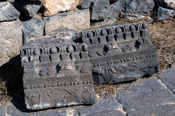 Variety of carved architectural features from the ruins at Sussita (Hippos) National Park on the...