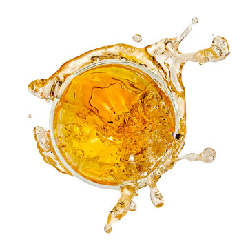 Beer splash from a glass, top view on white background, studio shot