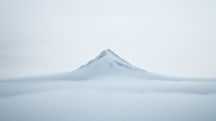 Majestic mountain peaks rise above sea of soft, white clouds, cr
