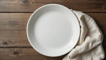 Empty Plate on Wooden Table with Soft Cloth Nearby