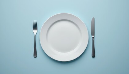 Empty Plate with Fork and Knife on Light Blue Background
