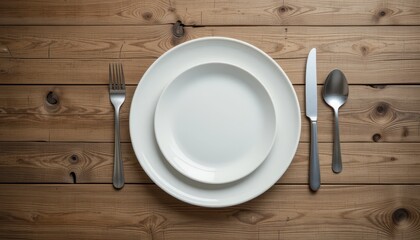Minimalist Table Setting with White Plates and Silver Cutlery